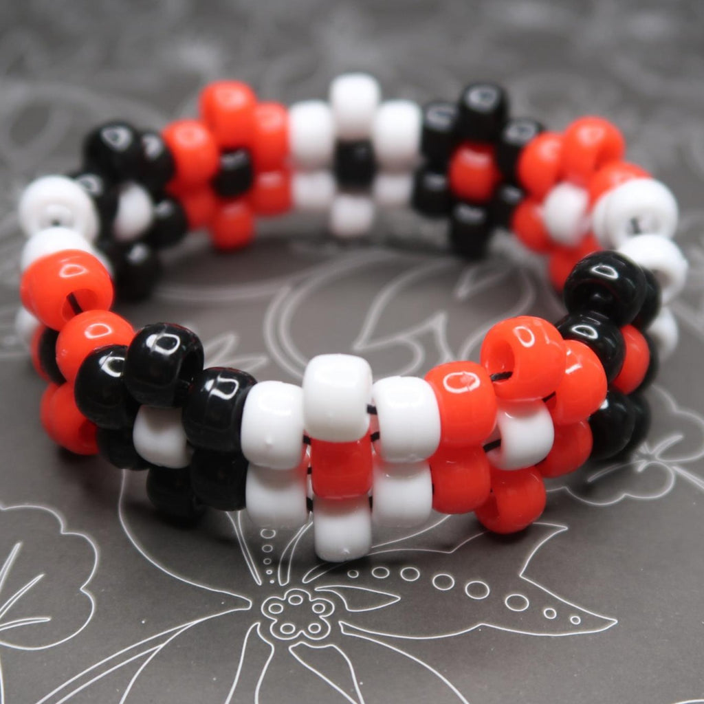 Rocky Horror Picture Show inspired Flower Kandi Cuff Bracelet done in bright red, white & black smooth pony beads in a cute flower pattern! this would be a great accessory for your next halloween rave or edm music festival